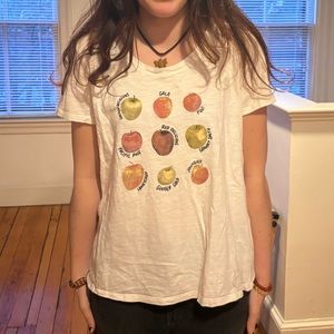 White shirt with different apples on it